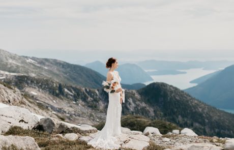 Bride in beautiful wedding dress on rocky mountain wedding