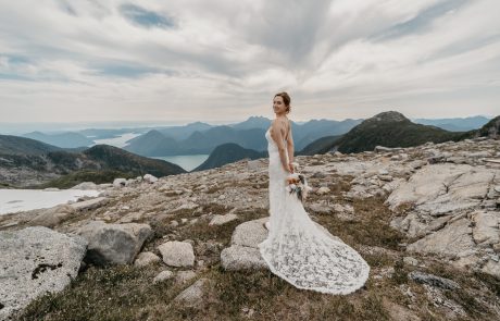 Bride in beautiful wedding dress on rocky mountain wedding